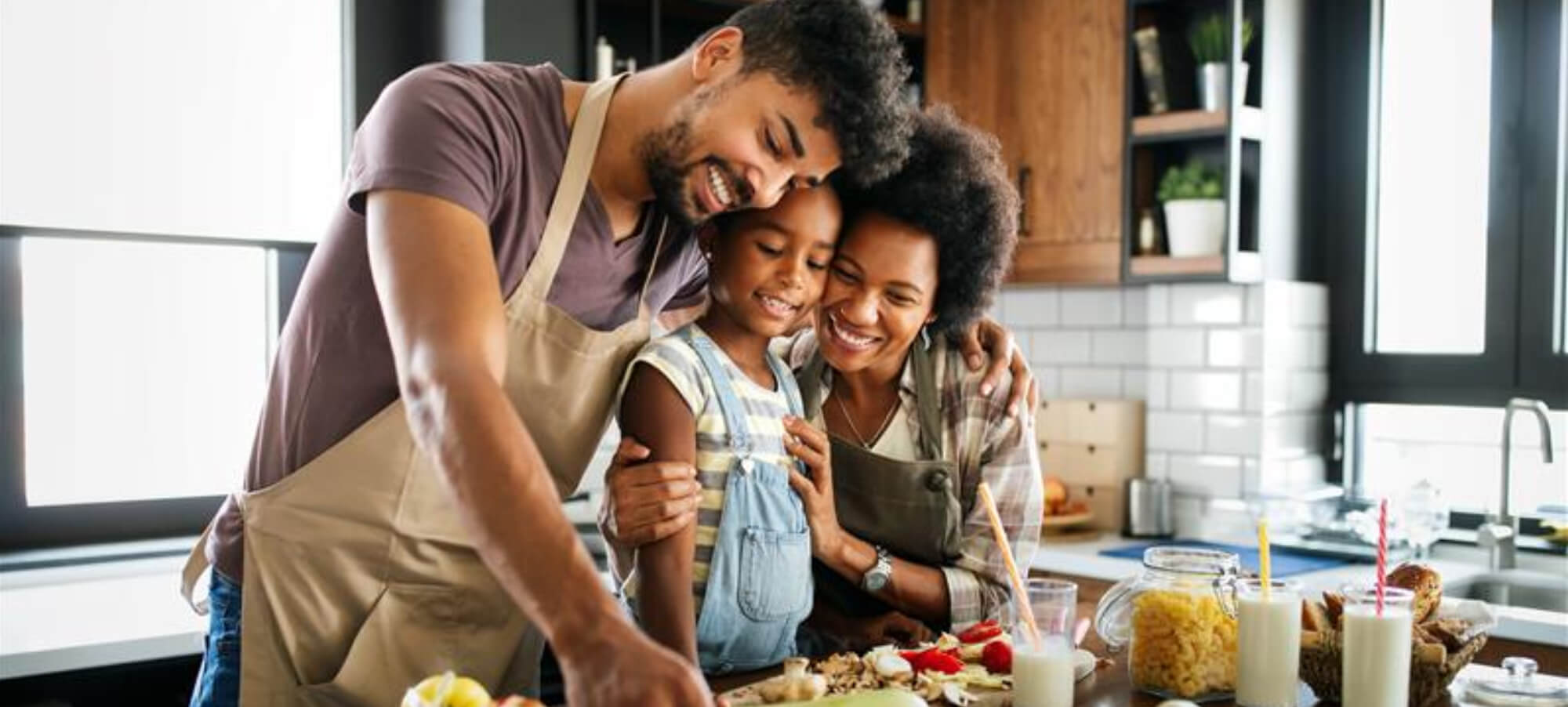 A family preparing food in a kitchen together